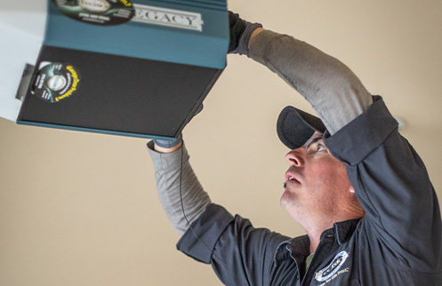 Technician Installing Garage Door Opener