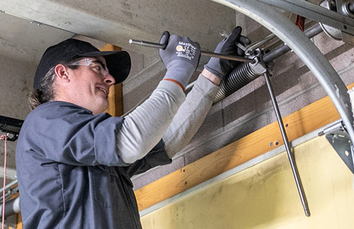 Technician Repairing Garage Door